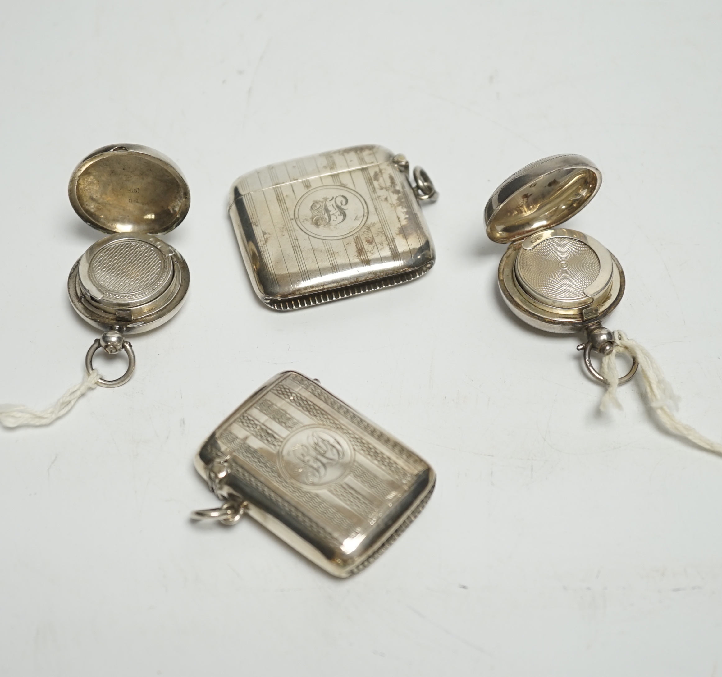 Two late 19th/early 20th century silver sovereign cases, 29mm and two silver vesta cases.